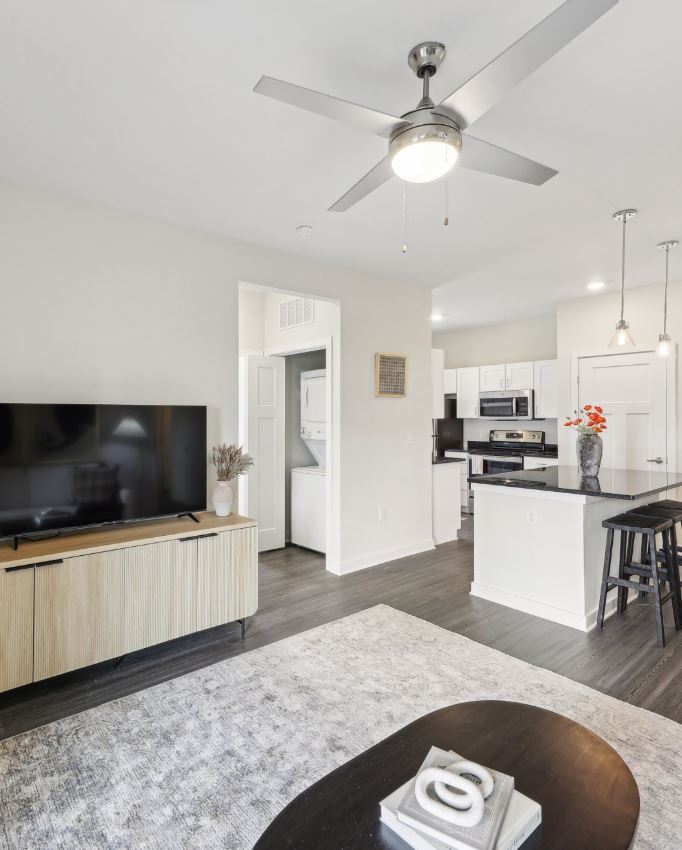 Photo of an open-concept living and dining room in an apartment unit at Banner at Sterling Farms. 