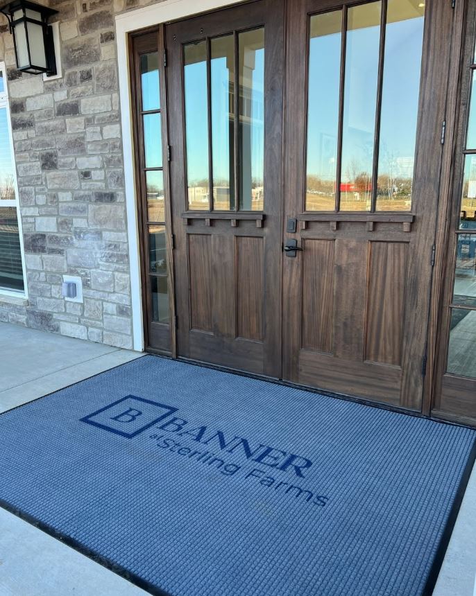 Photo of the front door of the club house at Banner at Sterling Farms. 